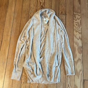 Very cozy camel colored cardigan. Super super soft material. Size M.